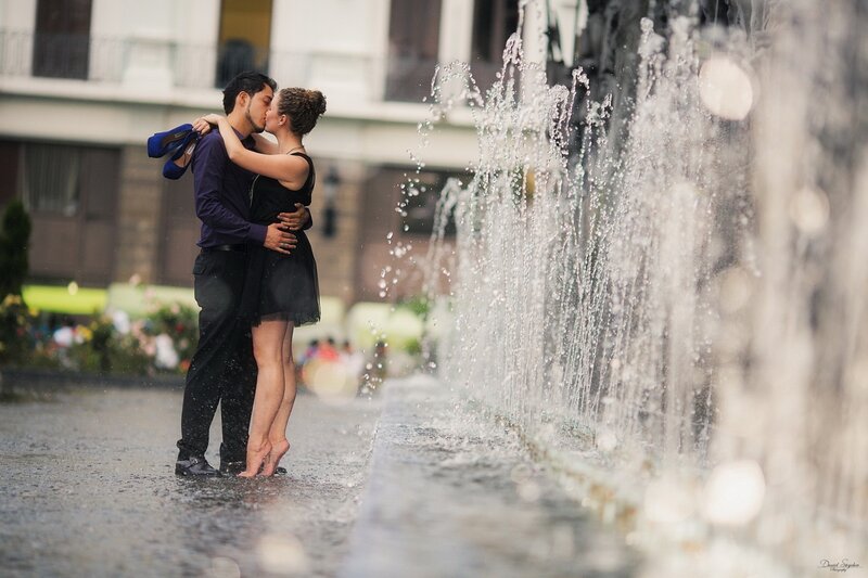 Couple kissing by fountain