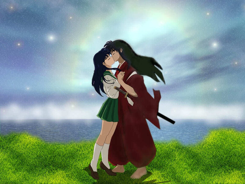 couple kissing by the sea
