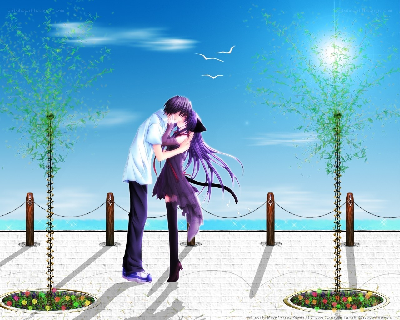 couple kissing by the sea