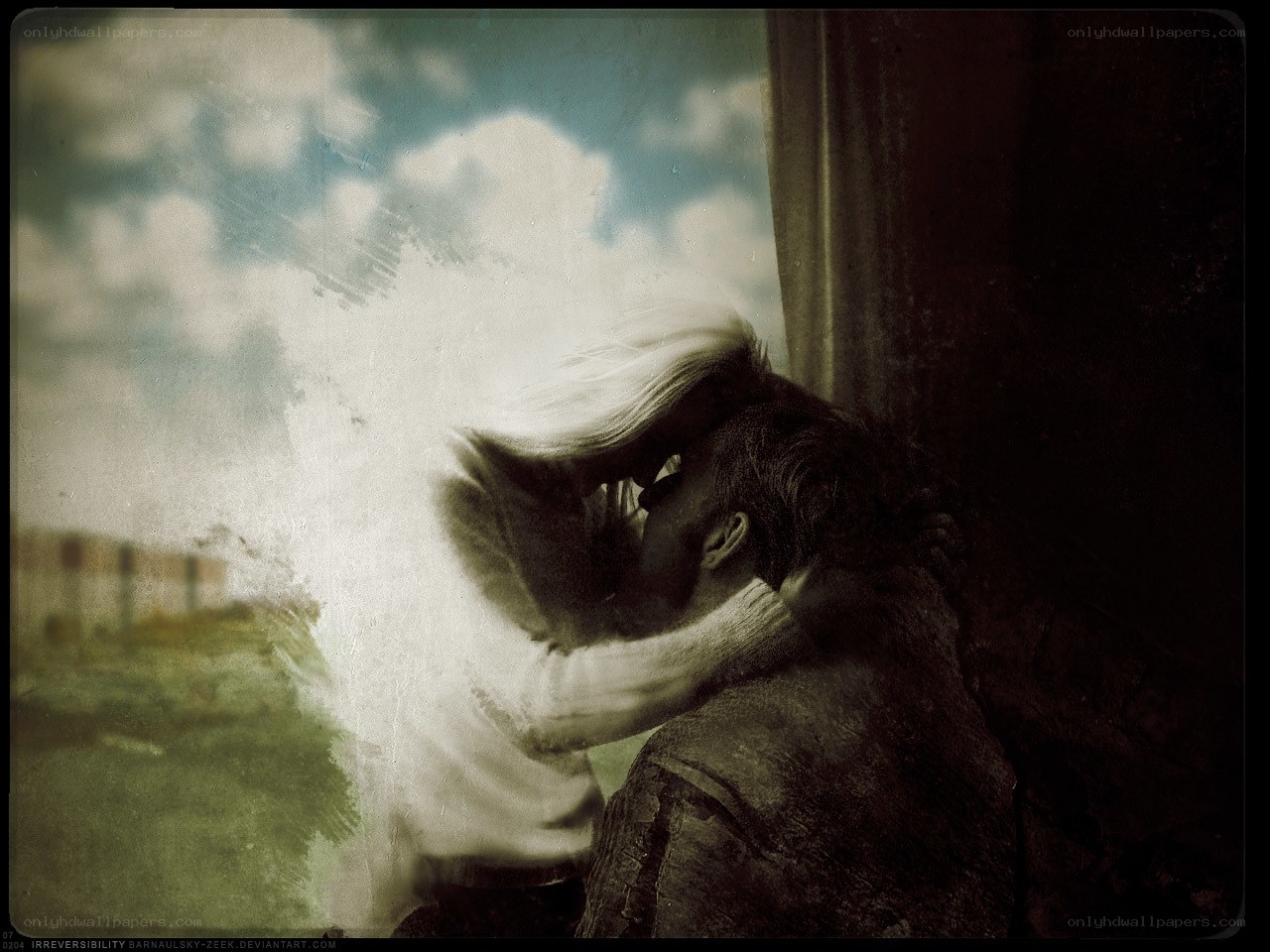 couple kissing by window