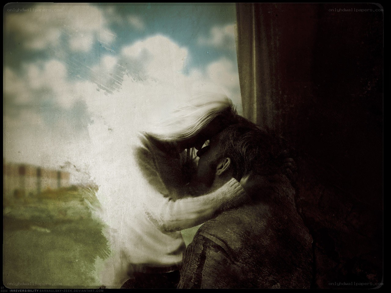 couple kissing by window
