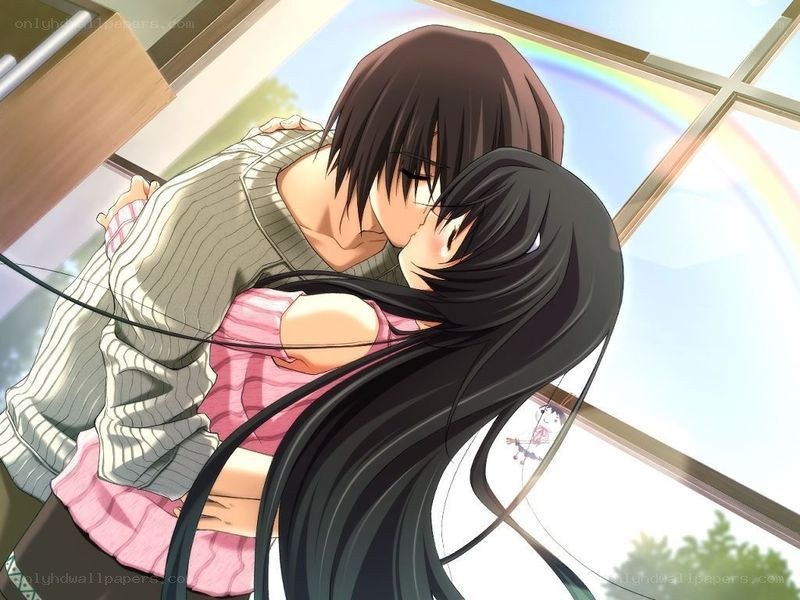couple kissing by window