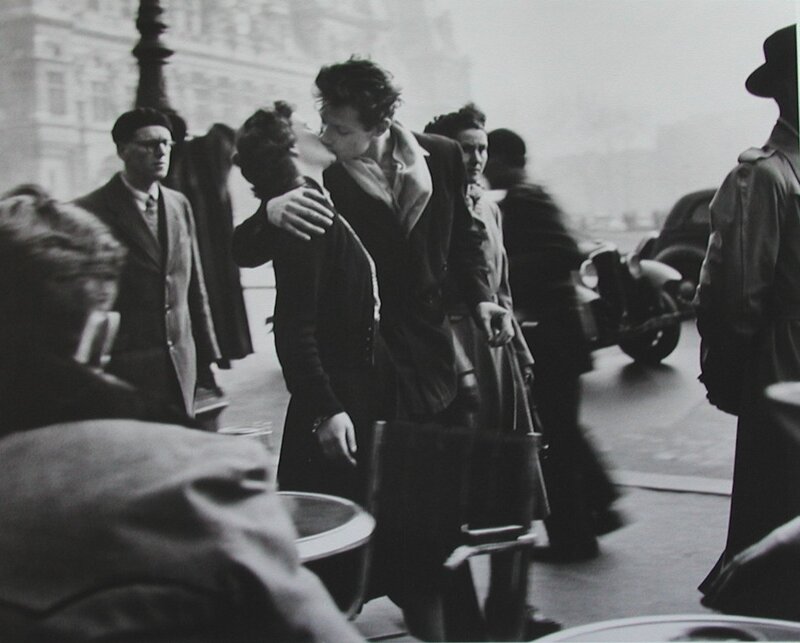 Couple kissing in a crowd