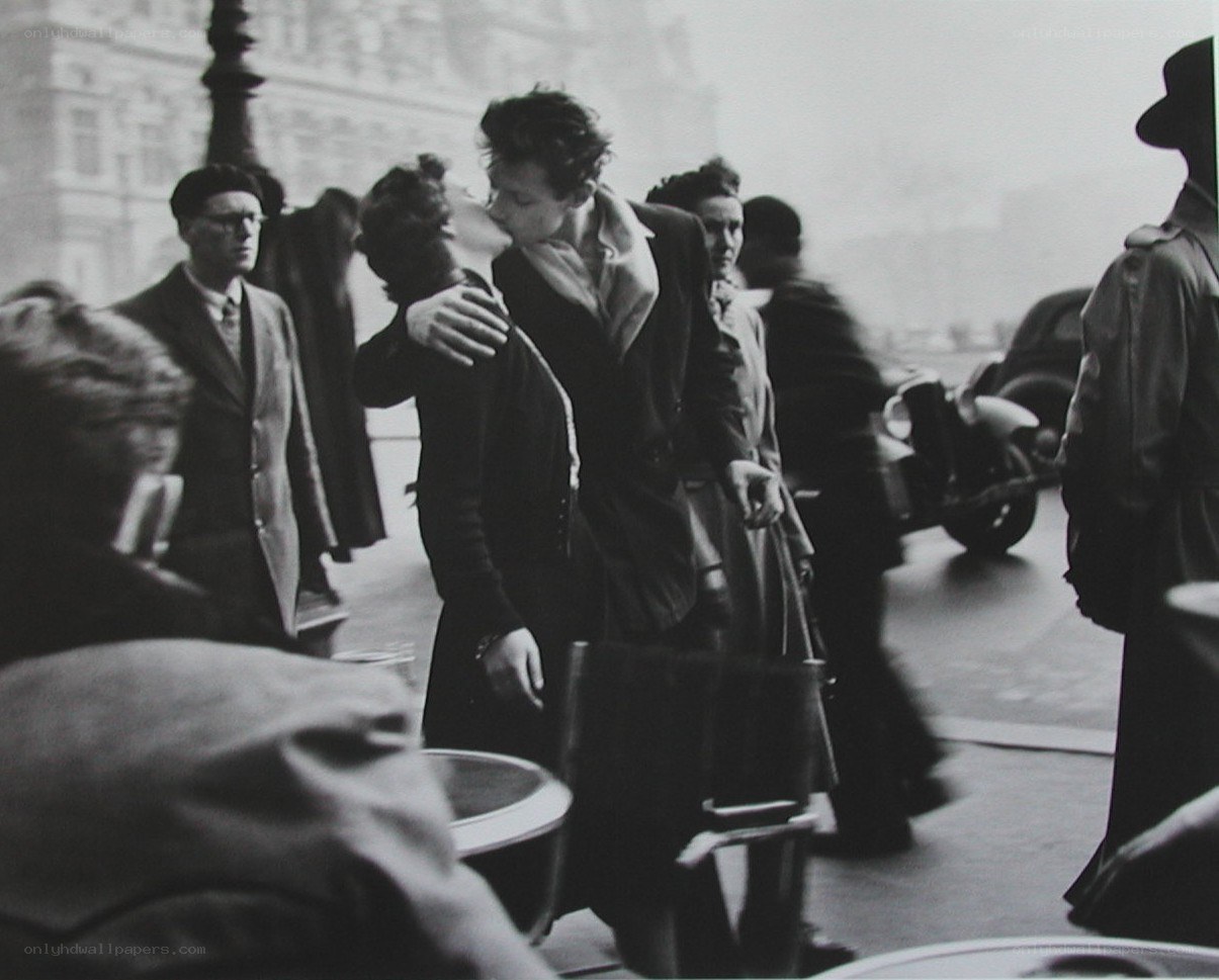 Couple kissing in a crowd