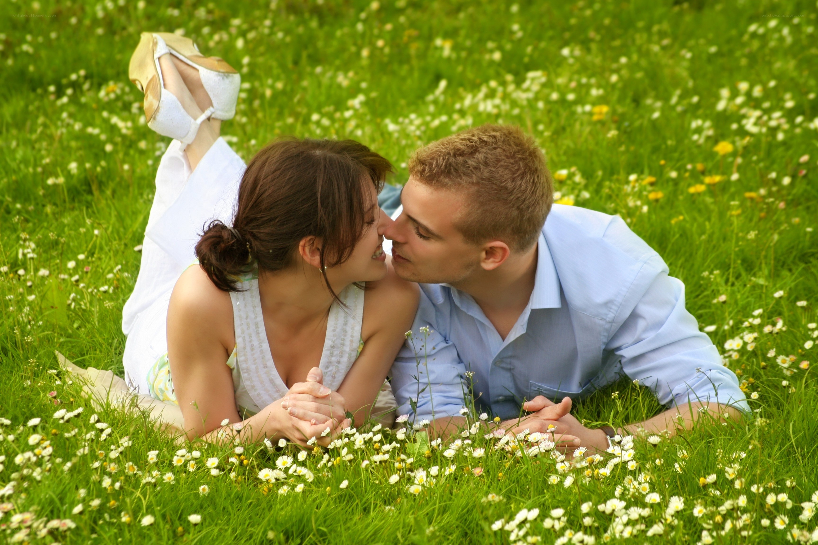 Couple kissing in a meadow
