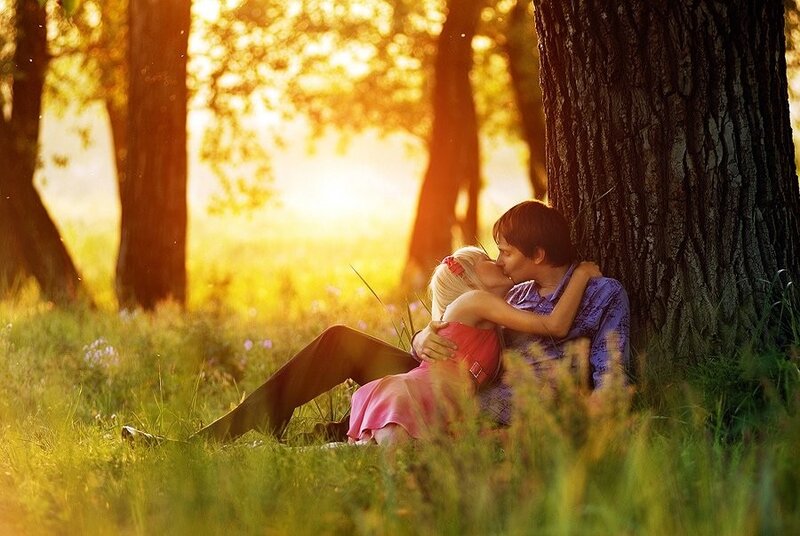 Couple kissing in a park