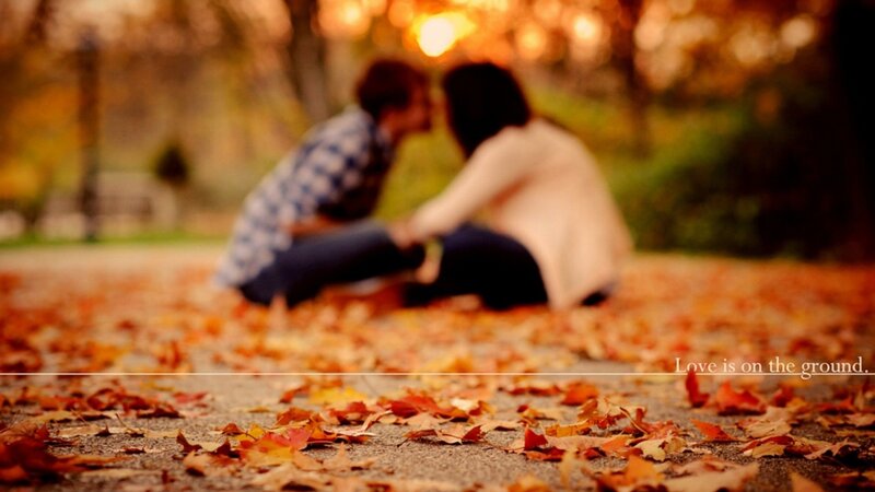 couple kissing in autumn