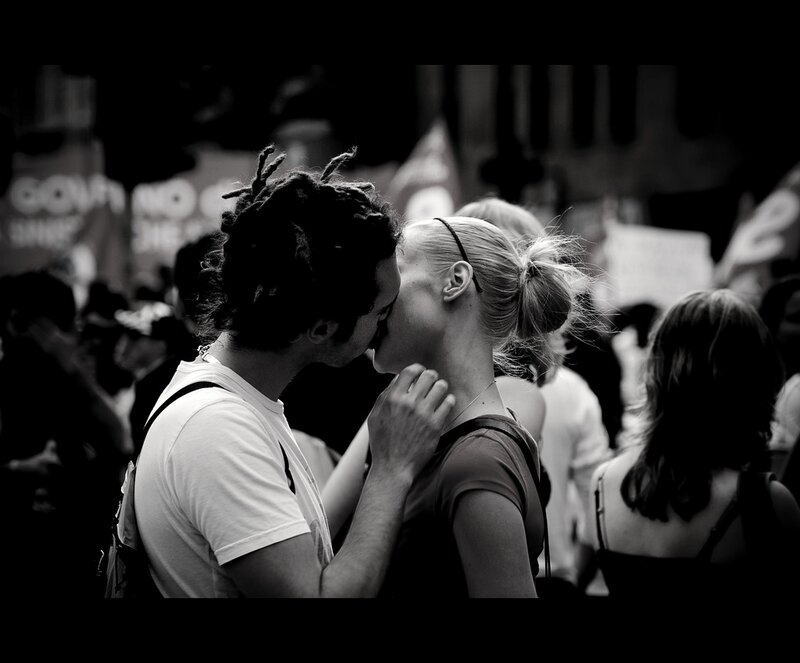 Couple Kissing in Crowd