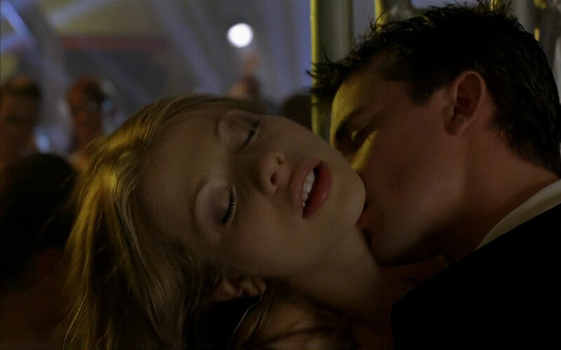 couple kissing in dim light