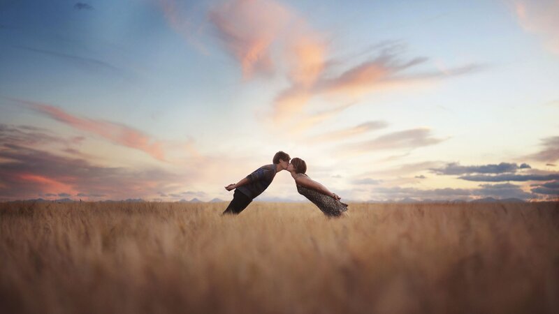 Couple Kissing in Field — Blue, Romantic, Sunset, Photograph