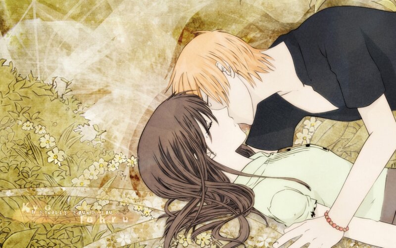 couple kissing in field