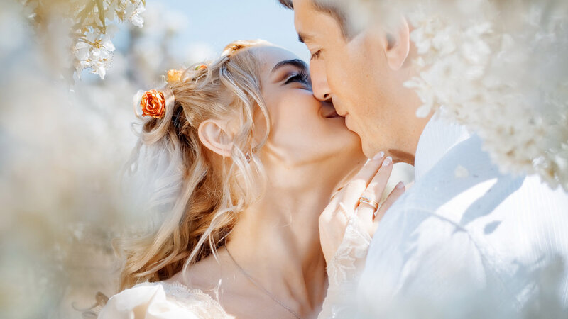 Couple Kissing in Flowers — White, Romantic, Spring, Photograph