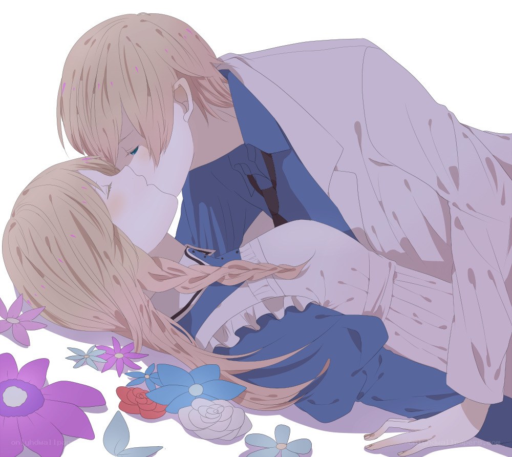 couple kissing in flowers