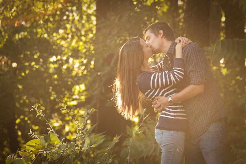 Couple Kissing in Forest — Green, Romantic, Sunset, Photograph
