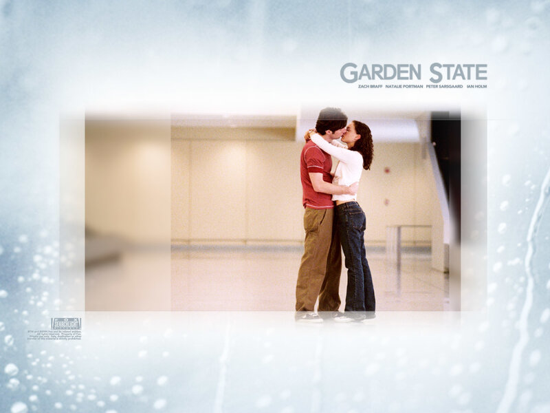 couple kissing in hallway