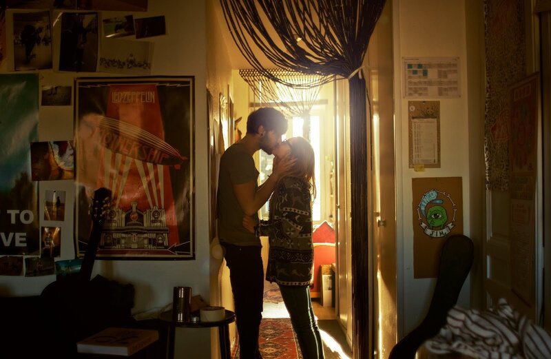 couple kissing in hallway