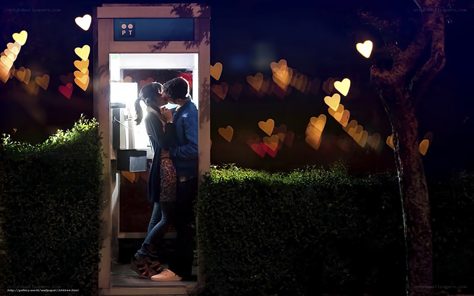 Couple kissing in phone booth