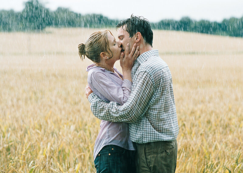 couple kissing in rain