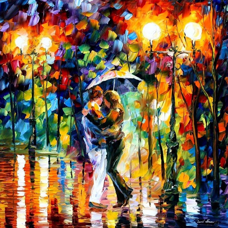 Couple kissing in rain under umbrella