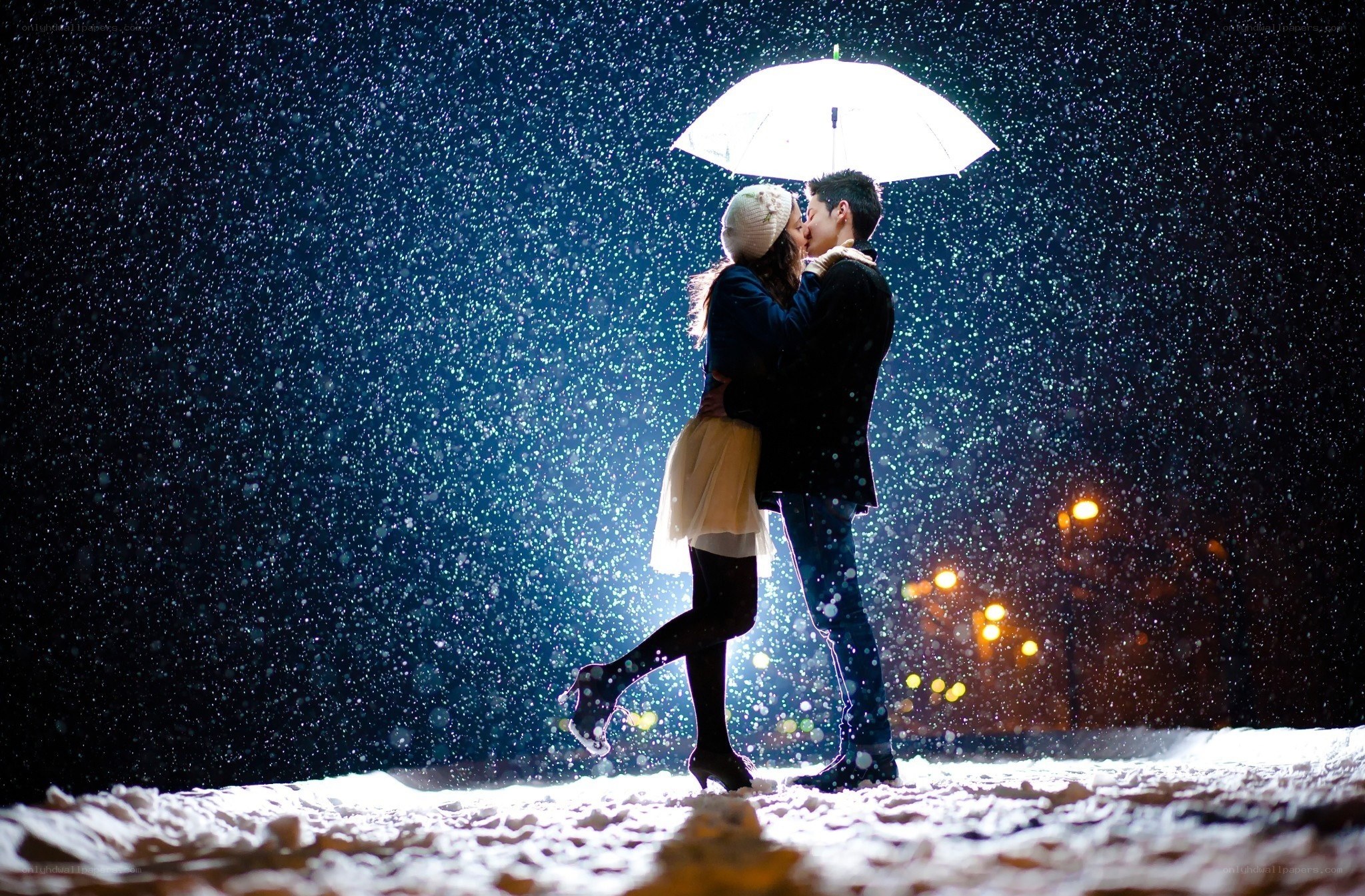 Couple kissing in snowstorm