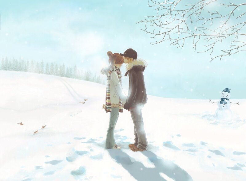 Couple kissing in snowy landscape