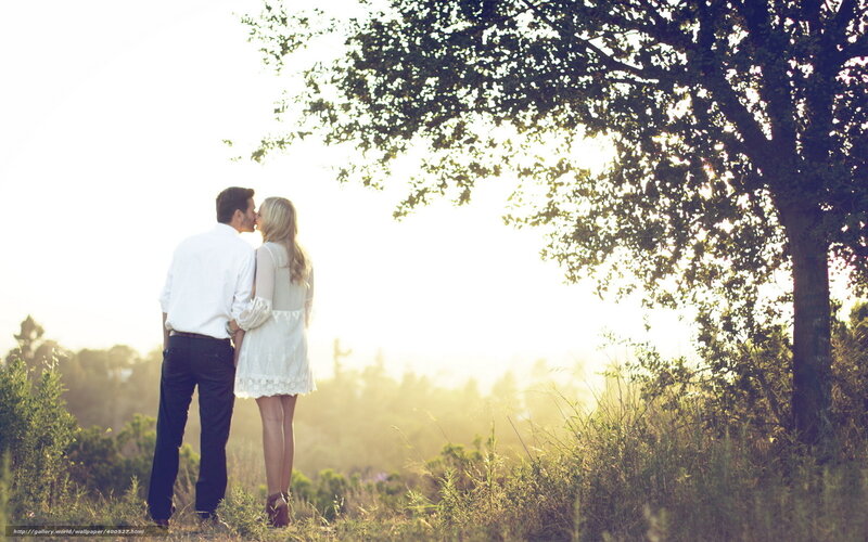 Couple kissing in sunset