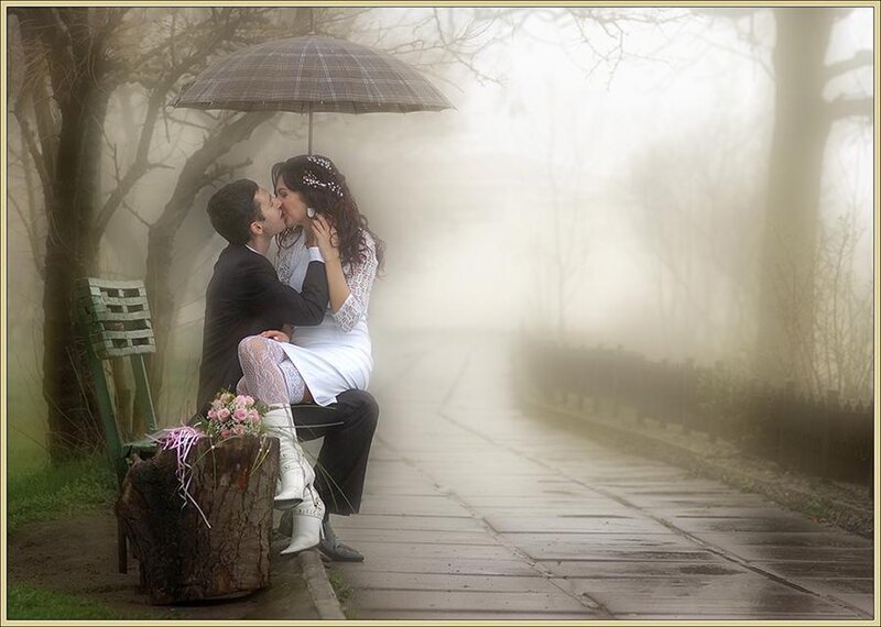 Couple kissing in the fog