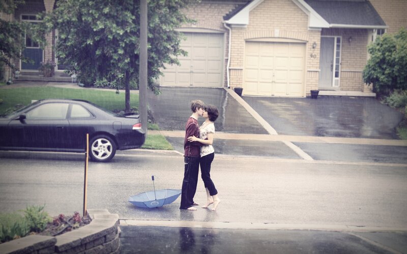 Couple kissing in the rain