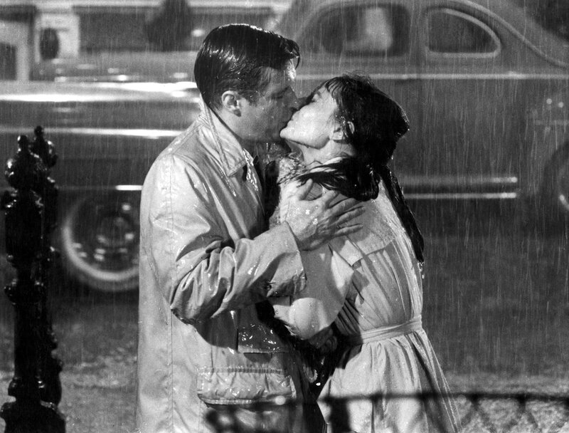 couple kissing in the rain