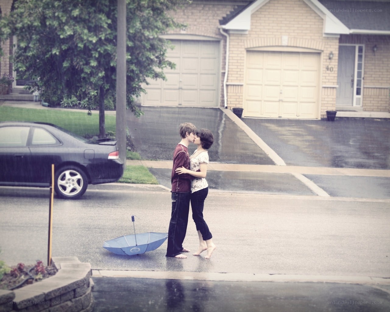 Couple kissing in the rain