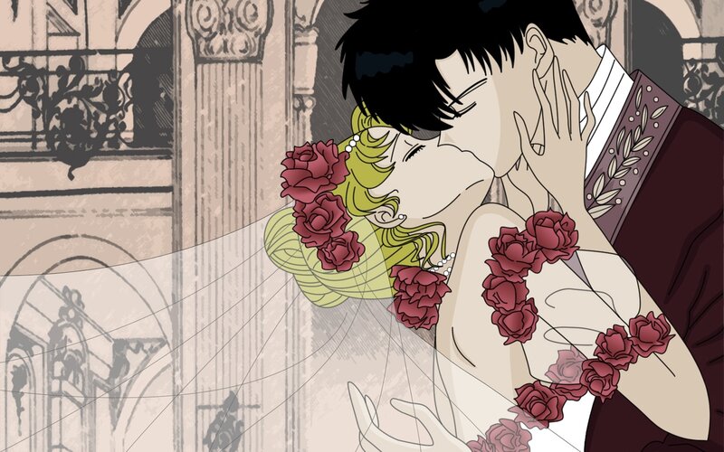couple kissing in wedding attire