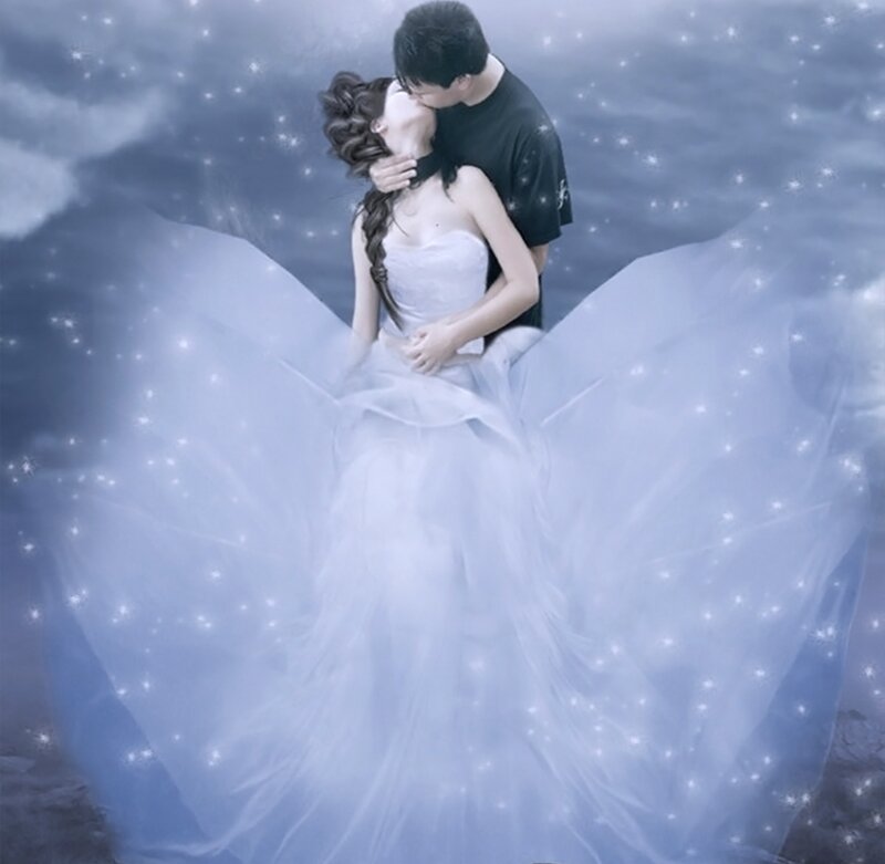 Couple Kissing in Wedding Dress