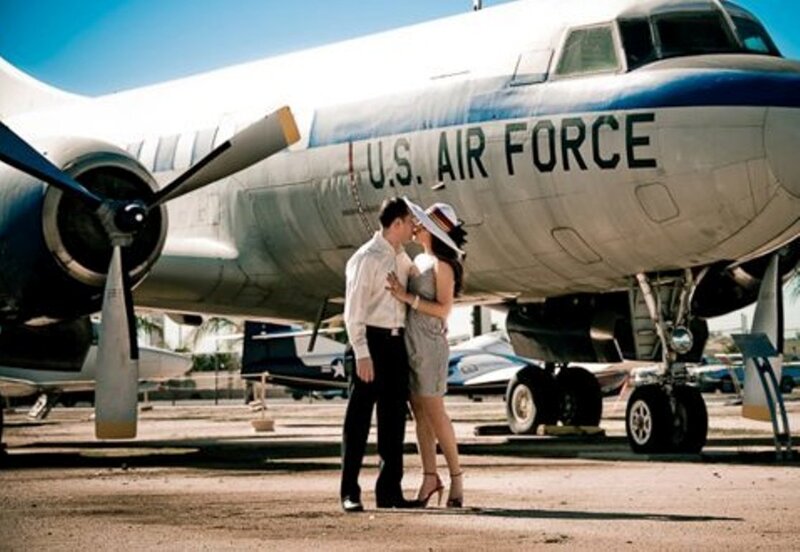 Couple Kissing Near Plane