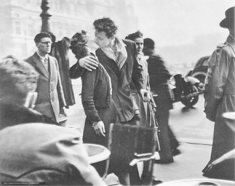 Couple kissing on a city street