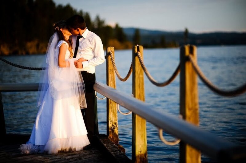 Couple kissing on a dock