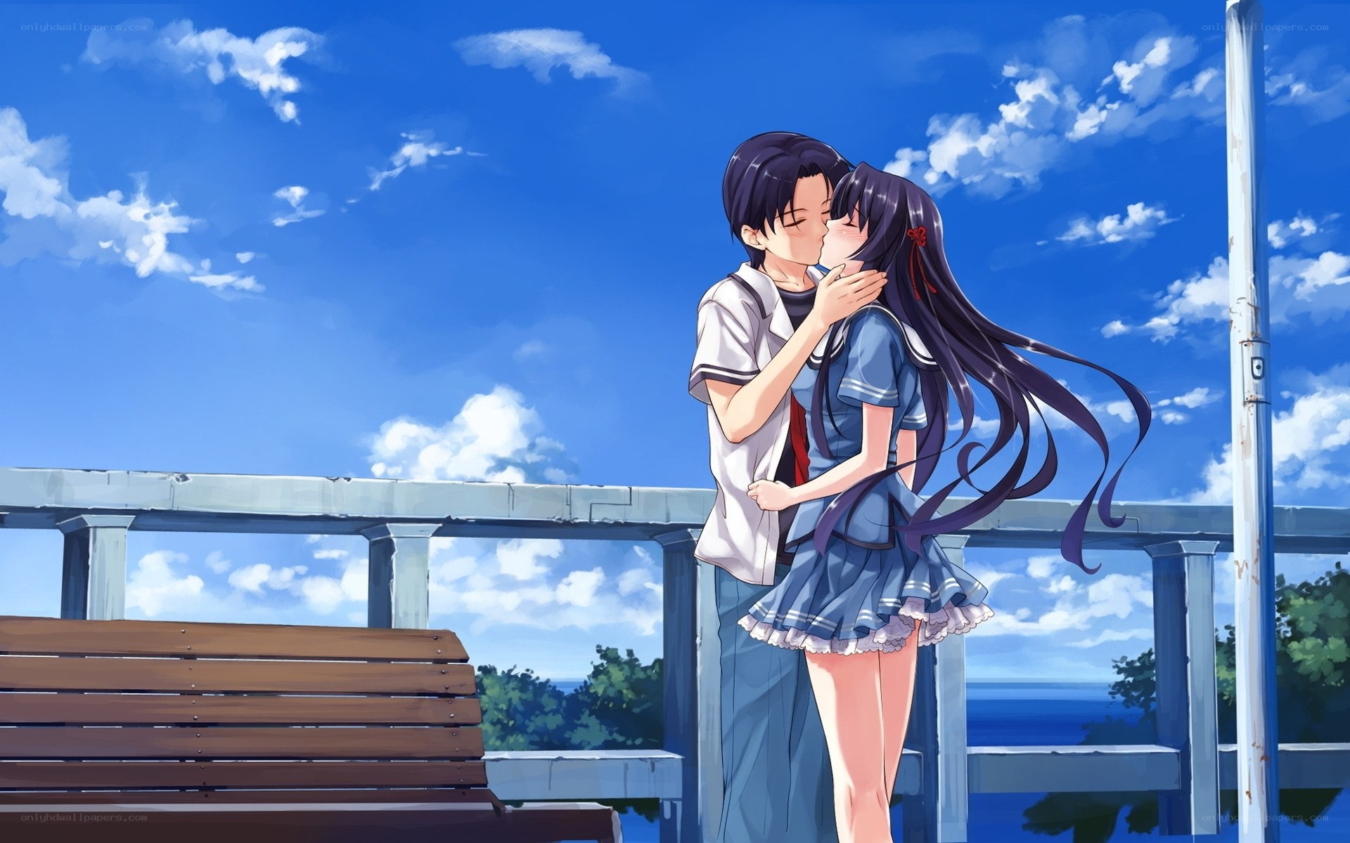 couple kissing on a pier