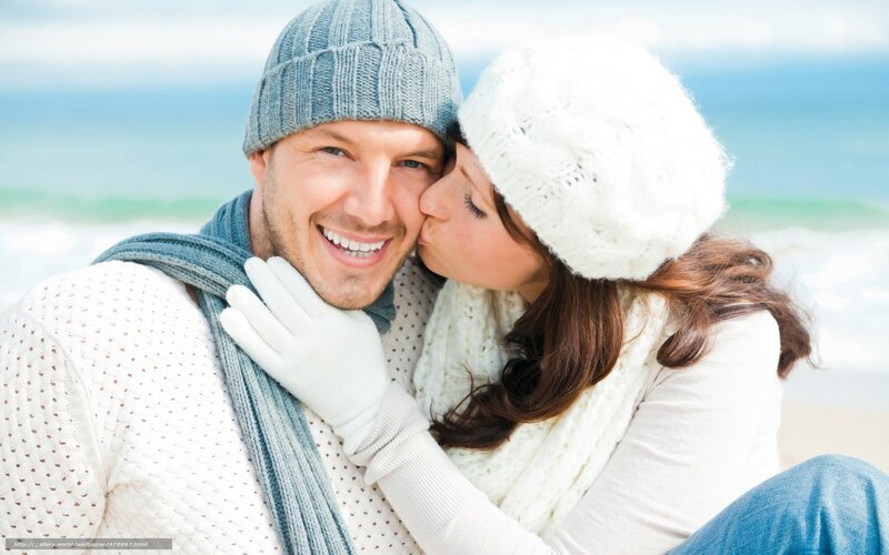 couple kissing on beach