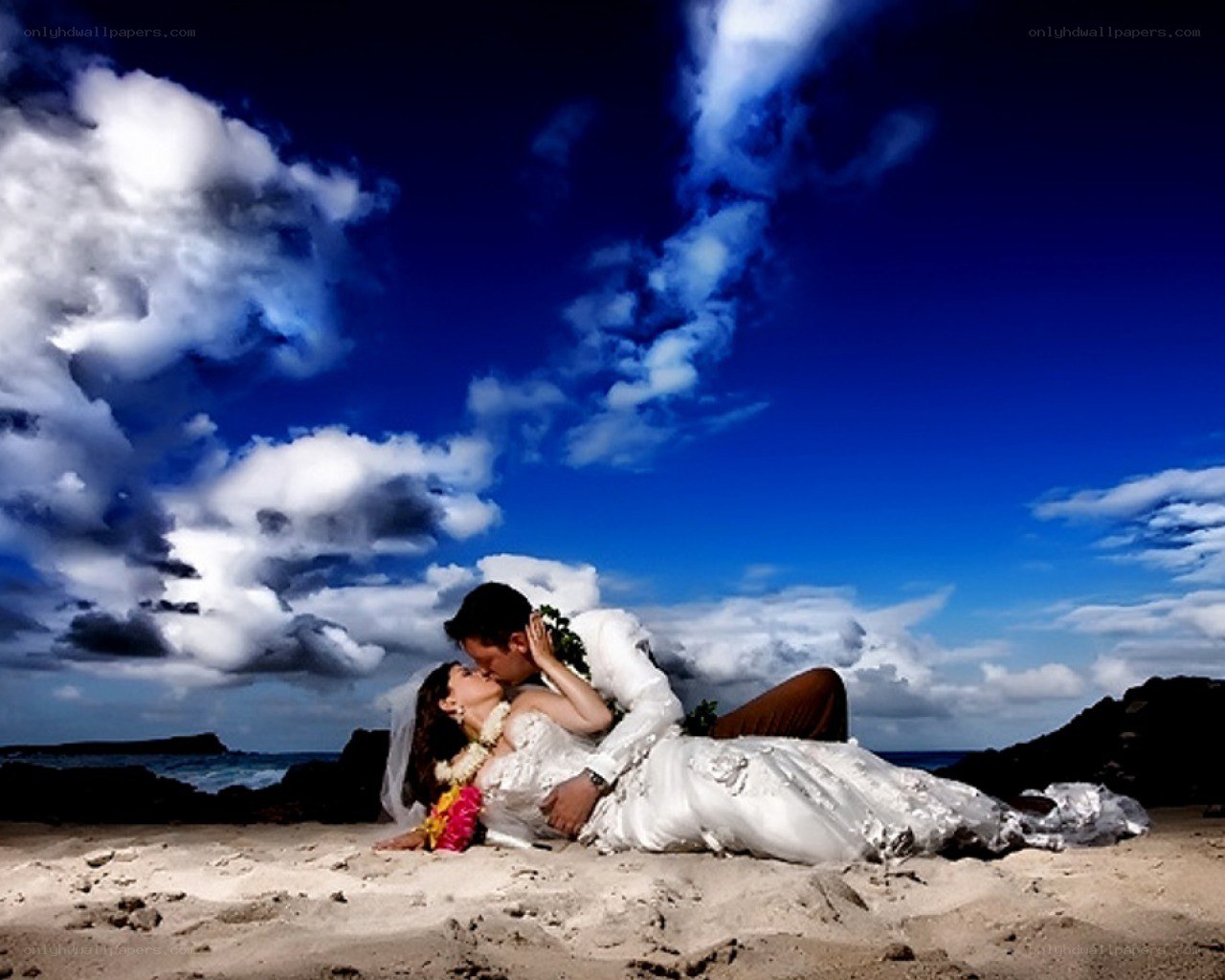 Couple kissing on beach