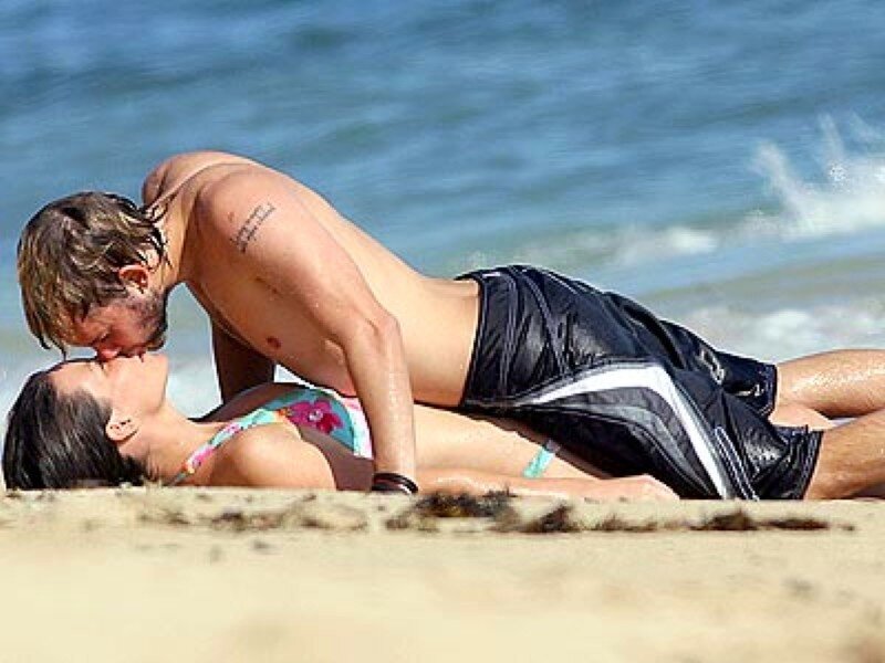 Couple kissing on beach