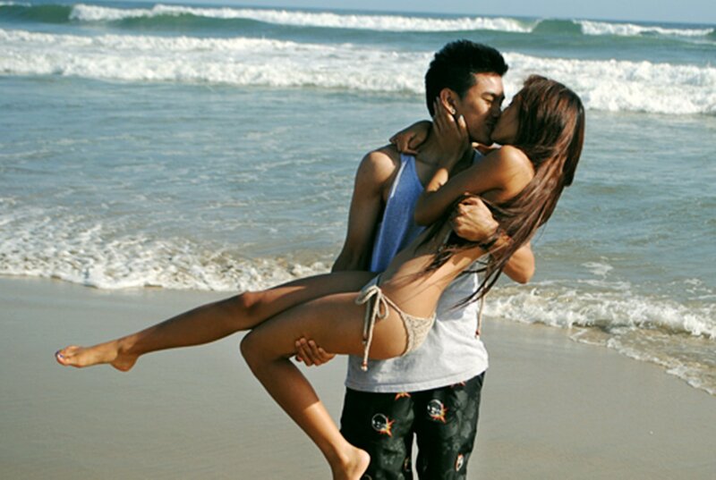 Couple Kissing on Beach — Blue, Romantic, Afternoon, Photograph