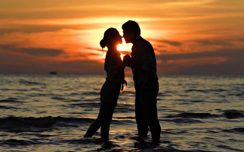 Couple Kissing on Beach — Orange, Romantic, Sunset, Photograph, Ocean
