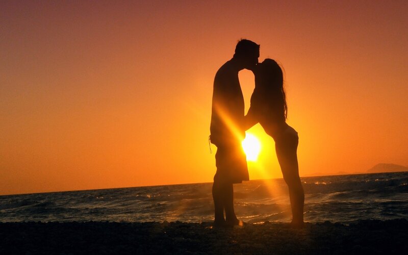 Couple Kissing on Beach — Orange, Romantic, Sunset, Photograph, Sun