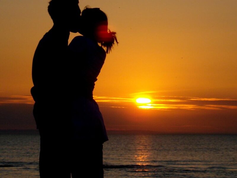 Couple Kissing on Beach — Orange, Romantic, Sunset, Photograph