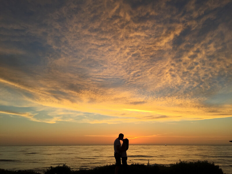 Couple Kissing on Beach — Orange, Serene