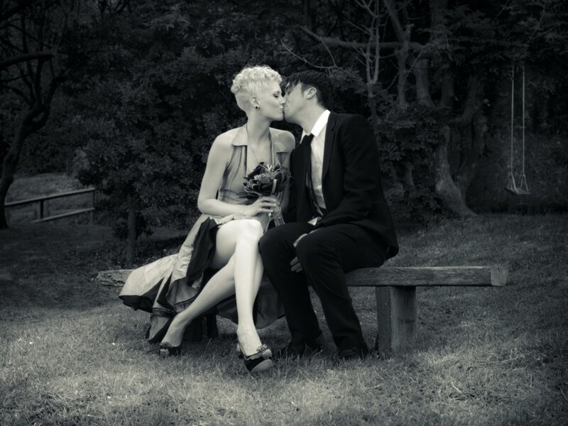 Couple Kissing on Bench — Black, Romantic, Photograph, Bouquet