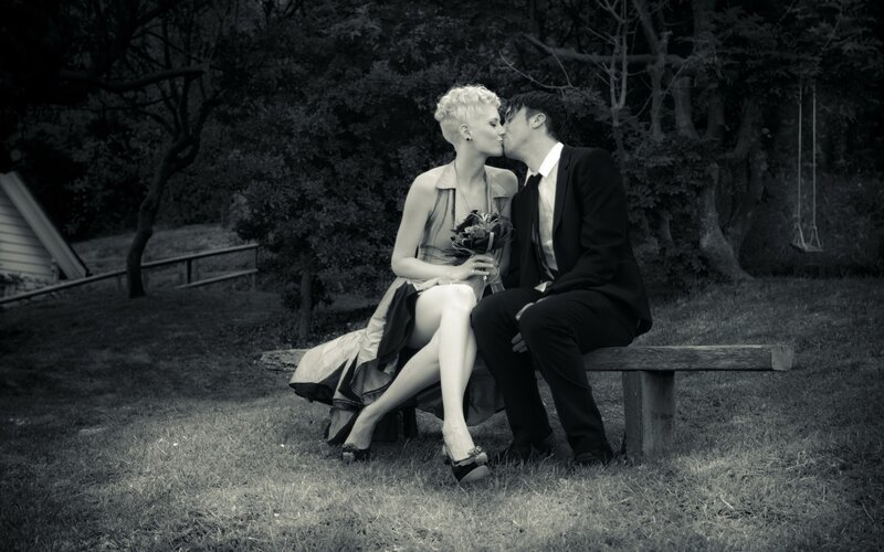 Couple Kissing on Bench — Black, Romantic