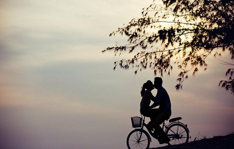 Couple Kissing on Bicycle — Purple
