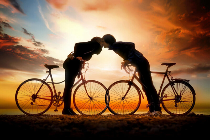 Couple Kissing on Bikes