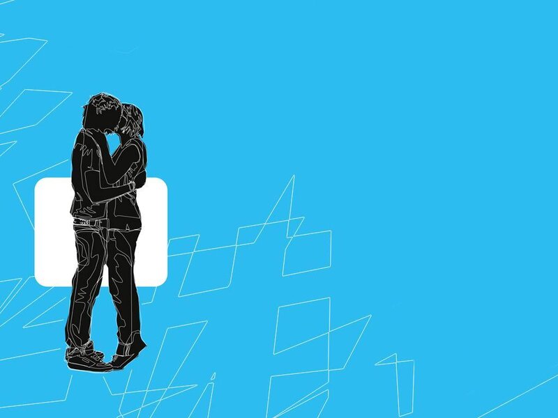 couple kissing on blue background