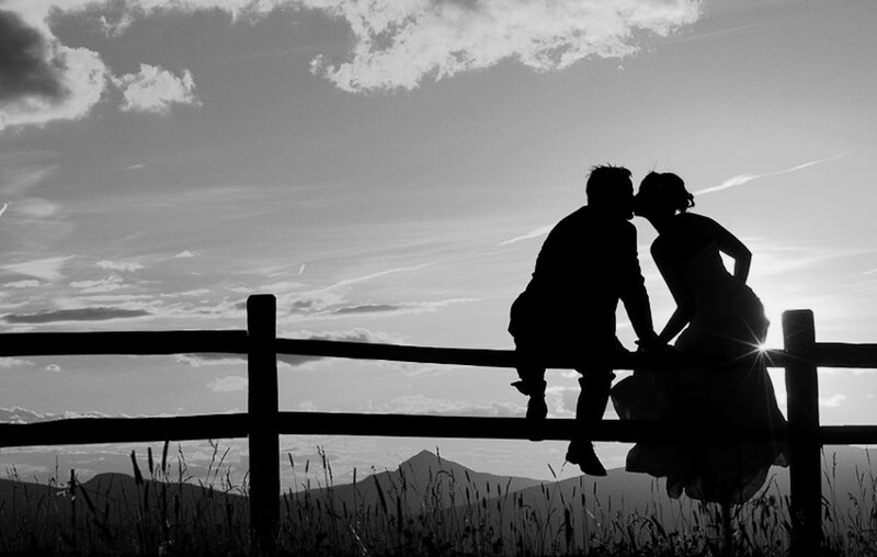 Couple Kissing on Fence